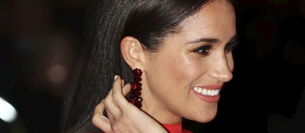 Britain's Meghan, Duchess of Sussex arrives with Prince Harry at the Royal Albert Hall in London, 7 March 2020, to attend the Mountbatten Festival of Music - Sputnik International