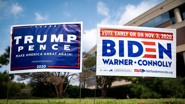 FILE PHOTO: Yard signs supporting U.S. President Donald Trump and Democratic U.S. presidential nominee and former Vice President Joe Biden are seen outside of an early voting site at the Fairfax County Government Center in Fairfax, Virginia, U.S., September 18, 2020. REUTERS/Al Drago/File Photo - Sputnik International