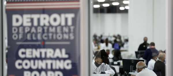 Detroit election workers work on counting absentee ballots for the 2020 general election at TCF Center on November 4, 2020 in Detroit, Michigan. - President Donald Trump and Democratic challenger Joe Biden are battling it out for the White House, with polls closed across the United States -- and the American people waiting for results in key battlegrounds still up for grabs. - Sputnik International