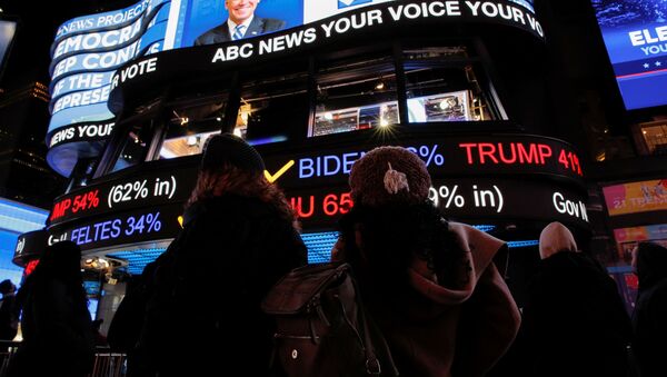 People watch early election results in Times Square in New York City, New York, U.S. November 3, 2020 - Sputnik International
