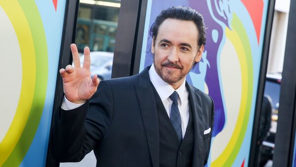 In this June 2, 2015 file photo, actor John Cusack arrives at the premiere of Love & Mercy in Beverly Hills, Calif. Cusack has apologized for tweeting an anti-Semitic cartoon and quotation after initially defending the post, then deleting it.  - Sputnik International