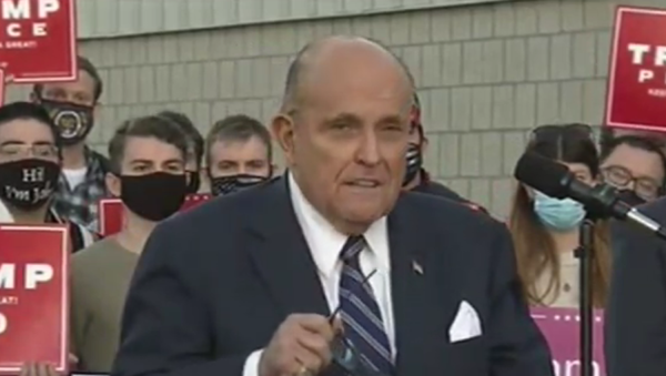 Rudy Giuliani speaks to reporters in Pennsylvania on November 4, 2020, about the Donald Trump campaign filing lawsuits to stop what he claims are fraudulent vote counts in the state - Sputnik International
