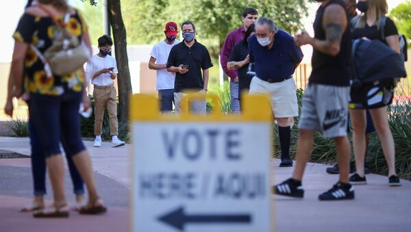 People line up to cast their vote at a polling station on Election Day in Surprise, Arizona, U.S., November 3, 2020 - Sputnik International