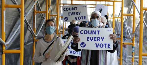 Protesters who want every vote counted from the 2020 presidential election, march down Woodward Avenue on 4 November 2020 in Detroit, Michigan. - Sputnik International