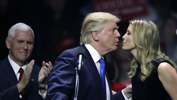 Republican presidential candidate Donald Trump kisses his daughter Ivanka, right, as vice presidential nominee, Indiana Gov. Mike Pence, left, applauds during a campaign rally, 7 November 2016, in Manchester, NH - Sputnik International