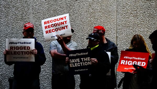 Supporters of U.S. President Donald Trump hold placards at a Stop the Steal protest outside Milwaukee Central Count the day after all of Milwaukee County’s absentee ballots were counted, in Milwaukee, Wisconsin, U.S. November 5, 2020. - Sputnik International