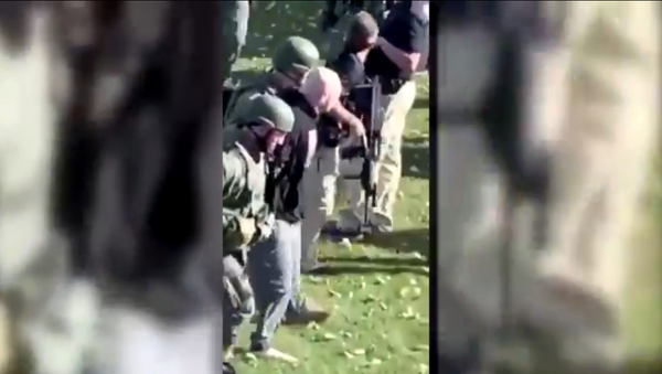 Screenshot from the video showing the moment of arrest of Nathanael Benton, a suspect in shooting of police officers in Wisconsin - Sputnik International