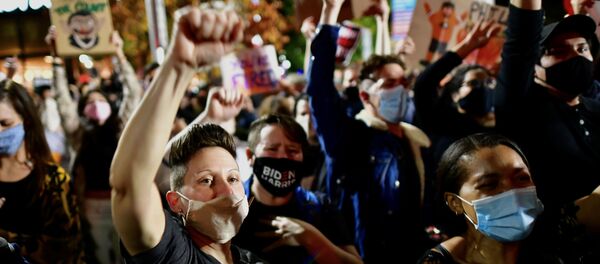 Activists cheer during a speech on a street, as votes continue to be counted following the 2020 U.S. presidential election, in Philadelphia, Pennsylvania, U.S., November 6, 2020.  - Sputnik International