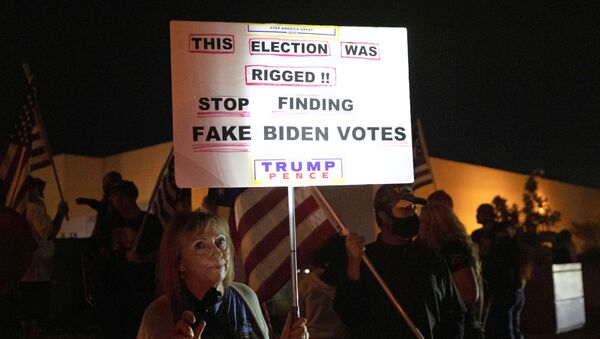 Judy Goff, a supporter of President Donald Trump, holds a sign during a Stop the Steal protest at the Clark County Election Center in North Las Vegas, Nevada, U.S. November 5, 2020. REUTERS/Steve Marcus - Sputnik International