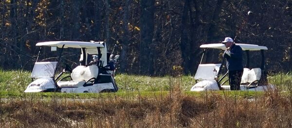 President Donald Trump participates in a round of golf at the Trump National Golf Course on Saturday, Nov. 7, 2020, in Sterling, Va - Sputnik International