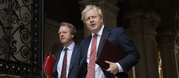 British Prime Minister Boris Johnson walks with Britain's Secretary of State for Scotland Alister Jack, left, into Downing Street, after attending a cabinet meeting at the Foreign Office in London on 21 July 2020. The countries which top the rankings of COVID-19 deaths globally are led by populist, mold-breaking leaders such as Johnson. The US, Brazil, the United Kingdom and Mexico all are led by leaders who have been sceptical of the scientists and who initially dismissed the disease. And their four countries alone account for half of the total 585,000 COVID-19 deaths worldwide so far, according to statistics tracked by Johns Hopkins University. British Prime Minister Boris Johnson walks with Britain's Secretary of State for Scotland Alister Jack, left, into Downing Street, after attending a cabinet meeting at the Foreign Office in London on 21 July 2020. The countries which top the rankings of COVID-19 deaths globally are led by populist, mold-breaking leaders such as Johnson. The US, Brazil, the United Kingdom and Mexico all are led by leaders who have been sceptical of the scientists and who initially dismissed the disease. And their four countries alone account for half of the total 585,000 COVID-19 deaths worldwide so far, according to statistics tracked by Johns Hopkins University. - Sputnik International