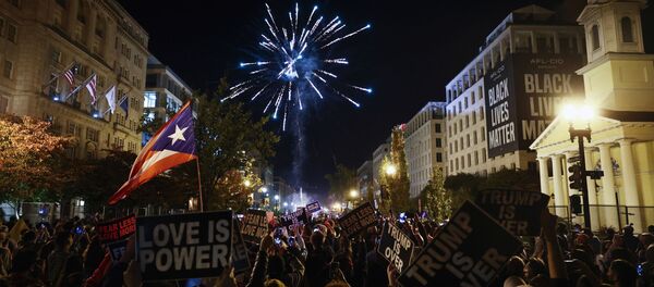 People light fireworks after news media declared Democratic candidate Joe Biden to be the winner of the 2020 U.S. presidential election, at BLM Plaza in Washington, DC, U.S., November 7, 2020 - Sputnik International