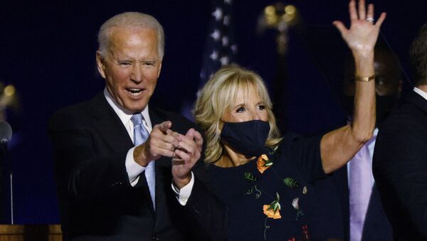 Democratic 2020 U.S. presidential nominee Joe Biden and his wife Jill celebrate onstage at his election rally, after the news media announced that Biden has won the 2020 U.S. presidential election over President Donald Trump, in Wilmington, Delaware, U.S., November 7, 2020. - Sputnik International