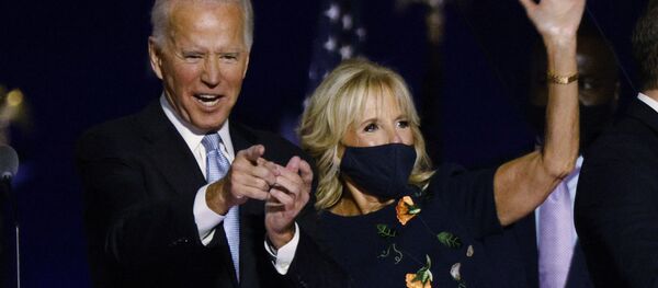 Democratic 2020 U.S. presidential nominee Joe Biden and his wife Jill celebrate onstage at his election rally, after the news media announced that Biden has won the 2020 U.S. presidential election over President Donald Trump, in Wilmington, Delaware, U.S., November 7, 2020. - Sputnik International