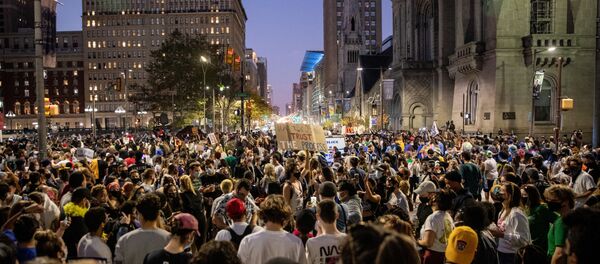 PHILADELPHIA, PENNSYLVANIA- NOVEMBER 07: People celebrate in the streets around city hall after Joe Biden was declared winner of the 2020 presidential election on November 07, 2020 in Philadelphia, Pennsylvania.  - Sputnik International