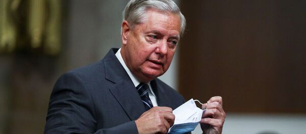 Senate Judiciary Committee Chairman Lindsey Graham (R-SC) arrives for a Senate Judiciary Committee meeting on the nomination of Judge Amy Coney Barrett to be an associate justice of the U.S. Supreme Court on Capitol Hill in Washington, U.S., October 22, 2020. Senate Judiciary Committee Chairman Lindsey Graham (R-SC) arrives for a Senate Judiciary Committee meeting on the nomination of Judge Amy Coney Barrett to be an associate justice of the U.S. Supreme Court on Capitol Hill in Washington, U.S., October 22, 2020. - Sputnik International