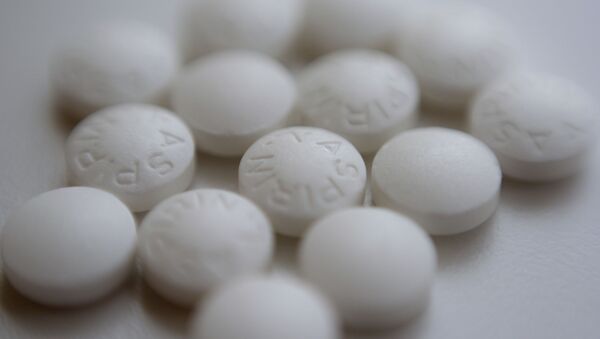This Thursday, Aug. 23, 2018 file photo shows an arrangement of aspirin pills in New York. A new study suggests millions of people need to rethink their use of aspirin to prevent a heart attack. If you've already had a heart attack, doctors recommend taking a low-dose aspirin a day to prevent a second one. But if you don't yet have heart disease, doctors now advise routine aspirin can do more harm than good. - Sputnik International