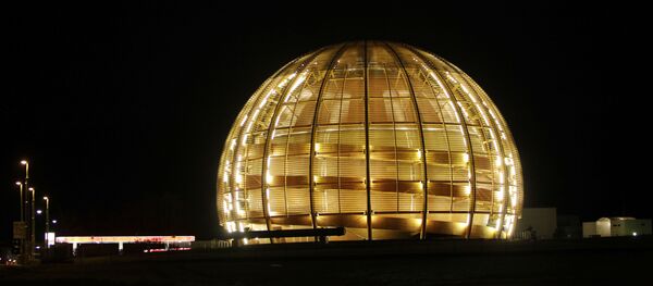  In this March 30, 2010 file picture the globe of the European Organization for Nuclear Research, CERN, is illuminated outside Geneva, Switzerland.  Two scientific teams have for the first time precisely recorded an extremely rare event in physics that adds certainty to how we think the universe began, leaders at the world's top particle physics lab said Friday July 19, 2013.  Two of the teams at the European Center for Nuclear Research, or CERN, say they measured a particle called Bs decaying into a pair of muons, a fundamental particle.  The results are being formally unveiled at a major physics conference in Stockholm later Friday. - Sputnik International