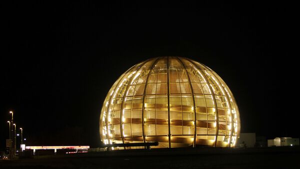  In this March 30, 2010 file picture the globe of the European Organization for Nuclear Research, CERN, is illuminated outside Geneva, Switzerland.  Two scientific teams have for the first time precisely recorded an extremely rare event in physics that adds certainty to how we think the universe began, leaders at the world's top particle physics lab said Friday July 19, 2013.  Two of the teams at the European Center for Nuclear Research, or CERN, say they measured a particle called Bs decaying into a pair of muons, a fundamental particle.  The results are being formally unveiled at a major physics conference in Stockholm later Friday. - Sputnik International