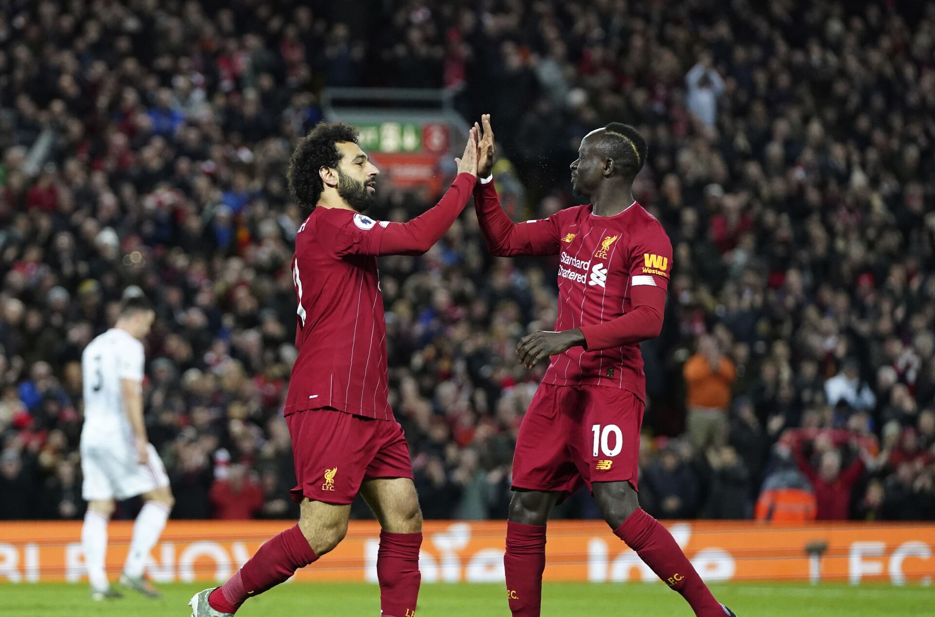 Liverpool's Mohamed Salah, front left, celebrates with Liverpool's Sadio Mane after scoring his side's opening goal during the English Premier League soccer match between Liverpool and Sheffield United at Anfield Stadium, Liverpool, England, Thursday, Jan. 2, 2020 - Sputnik International, 1920, 25.09.2021
