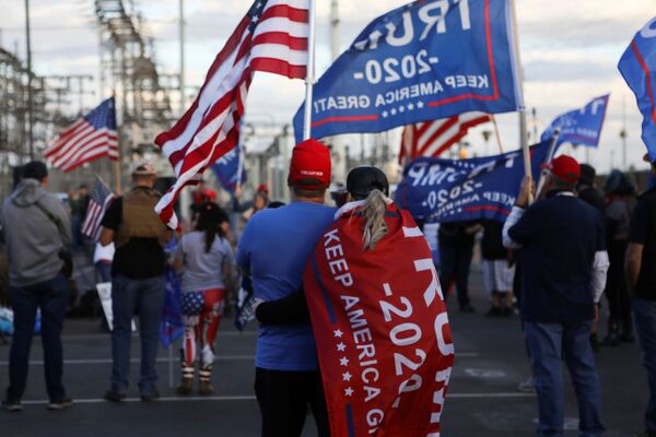 Supporters of US President Donald Trump gather at a Stop the Steal protest after the 2020 US presidential election was called for former Vice President Joe Biden, in front of the Maricopa County Tabulation and Election Center (MCTEC), in Phoenix, Arizona, US, November 8, 2020 - Sputnik International
