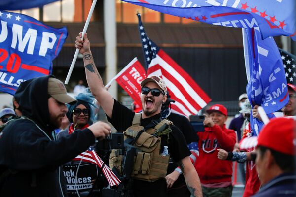 A supporter of US President Donald Trump yells during a Stop the Steal protest after the 2020 US presidential election was called for former Vice President Joe Biden, in front of the Maricopa County Tabulation and Election Center (MCTEC), in Phoenix, Arizona, US, November 8, 2020 - Sputnik International