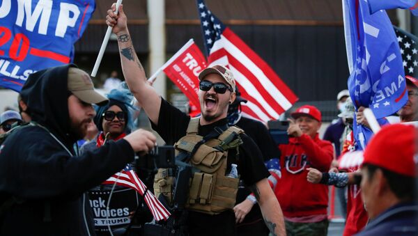 A supporter of US President Donald Trump yells during a Stop the Steal protest after the 2020 US presidential election was called for former Vice President Joe Biden, in front of the Maricopa County Tabulation and Election Center (MCTEC), in Phoenix, Arizona, 8 November 2020 - Sputnik International