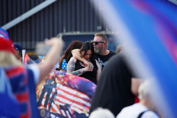 Trump supporters embrace as they console each other at a Stop the Steal protest after the 2020 US presidential election was called for Democratic candidate Joe Biden, in front of the Maricopa County Tabulation and Election Center (MCTEC), in Phoenix, Arizona, US, November 7, 2020 - Sputnik International