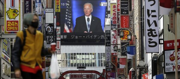 A screen shows live broadcast of President-elect Joe Biden speaking Sunday, Nov. 8, 2020 at the Shinjuku shopping district in Tokyo A screen shows live broadcast of President-elect Joe Biden speaking Sunday, Nov. 8, 2020 at the Shinjuku shopping district in Tokyo - Sputnik International