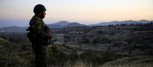 An Azeri soldier inspects the city of Cebrayil, where Azeri forces regained control during the fighting over the breakaway region of Nagorno-Karabakh, Azerbaijan October 16, 2020 - Sputnik International
