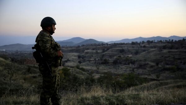 An Azeri soldier inspects the city of Cebrayil, where Azeri forces regained control during the fighting over the breakaway region of Nagorno-Karabakh, Azerbaijan October 16, 2020 - Sputnik International