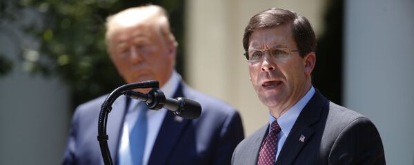 Defense Secretary Mark Esper speaks as President Donald Trump listens during a press briefing about the coronavirus in the Rose Garden of the White House, Friday, May 15, 2020, in Washington. (AP Photo/Alex Brandon) Defense Secretary Mark Esper speaks as President Donald Trump listens during a press briefing about the coronavirus in the Rose Garden of the White House, Friday, May 15, 2020, in Washington. (AP Photo/Alex Brandon) - Sputnik International