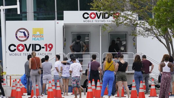 People line up at a COVID-19 rapid test site, Saturday, Nov. 7, 2020 in Miami Beach, Fla. According to an AP analysis of data from John Hopkins University, the 7-day rolling average for daily new cases rose from 61,166 on Oct. 22 to 94,625 on Nov. 5.  - Sputnik International