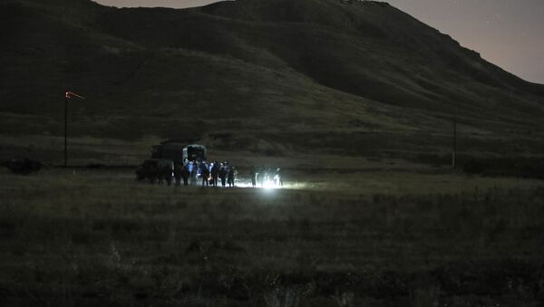 Armenian and Russian soldiers search the site of wreckage of a downed Russian military helicopter which was shot down in Armenia near the border with Azerbaijan, near Eraskh, Armenia, Monday, Nov. 9, 2020. - Sputnik International