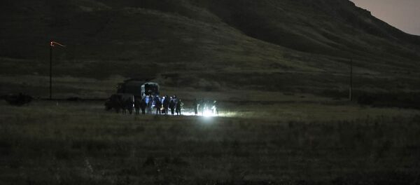 Armenian and Russian soldiers search the site of wreckage of a downed Russian military helicopter which was shot down in Armenia near the border with Azerbaijan, near Eraskh, Armenia, Monday, Nov. 9, 2020. - Sputnik International