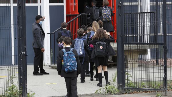 Year seven pupils are directed to socially distance as they arrive for their first day at Kingsdale Foundation School in London, Thursday, Sept. 3, 2020 - Sputnik International