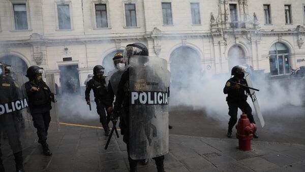 Police work to disperse supporters of former President Martín Vizcarra protesting the swearing-in of a new president, Manuel Merino, who was head of Peru's legislature, at San Martin square in Lima, Peru, Tuesday, Nov. 10, 2020. - Sputnik International