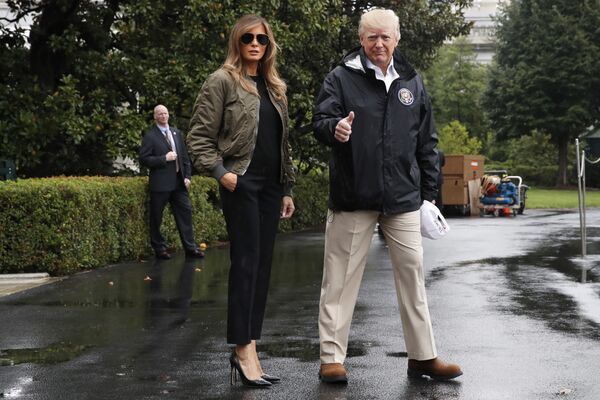President Donald Trump, accompanied by first lady Melania Trump, gives a thumbs-up as they walk to Marine One on the South Lawn of the White House in Washington, for a short trip to Andrews Air Force Base, Maryland, then on to Texas to survey the response to Hurricane Harvey.   - Sputnik International