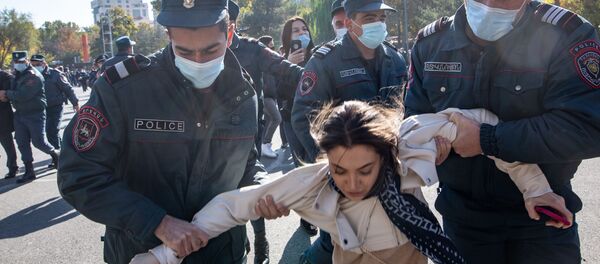 Police officers detain a demonstrator during a protest, which was organized by 17 opposition parties, against the prime minister's decision to sign a ceasefire deal with Baku , at Independance Square, in Yerevan, Armenia Police officers detain a demonstrator during a protest, which was organized by 17 opposition parties, against the prime minister's decision to sign a ceasefire deal with Baku , at Independance Square, in Yerevan, Armenia - Sputnik International