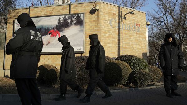 Policemen patrol outside the Canadian Embassy in Beijing, Wednesday, Dec. 12, 2018 - Sputnik International