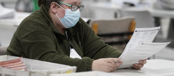 An officials works on ballots at the Gwinnett County Voter Registration and Elections Headquarters, Friday, Nov. 6, 2020, in Lawrenceville, near Atlanta. An officials works on ballots at the Gwinnett County Voter Registration and Elections Headquarters, Friday, Nov. 6, 2020, in Lawrenceville, near Atlanta. - Sputnik International