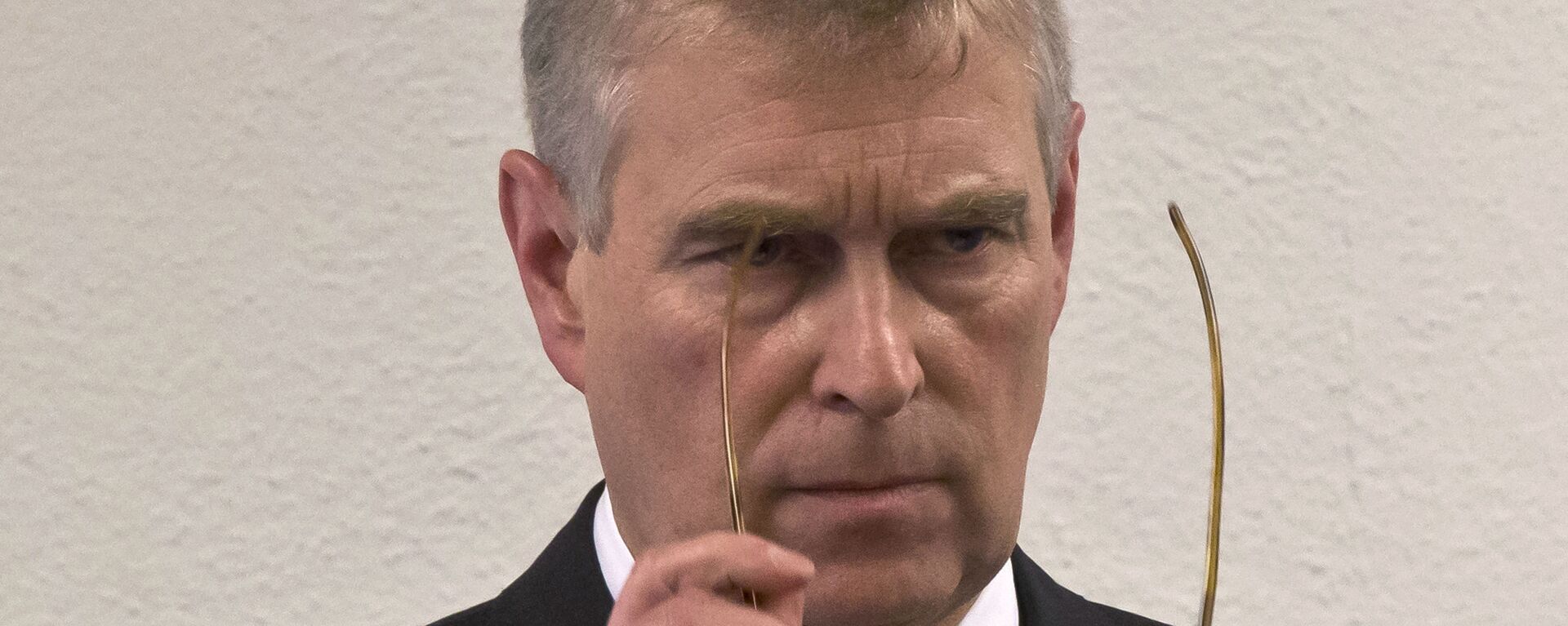 In this file photo dated Thursday, 22 January 2015, Britain's Prince Andrew puts on his glasses prior to his speech to business leaders during a reception on the sideline of the World Economic Forum in Davos.  - Sputnik International, 1920, 21.04.2021