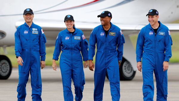 NASA astronauts Shannon Walker, Victor Glover, Mike Hopkins, and JAXA (Japan Aerospace Exploration Agency) and astronaut Soichi Noguchi, who comprise Crew-1, walk at Kennedy Space Center ahead of the NASA/SpaceX launch of the first operational commercial crew mission in Cape Canaveral, Florida, 8 November 2020 - Sputnik International