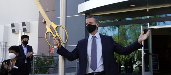 California Gov. Gavin Newsom participates in a ribbon cutting ceremony at a COVID-19 testing facility Friday, Oct. 30, 2020, in Valencia, Calif. Newsom announced the new $120 million, 134,000 sq. foot coronavirus testing facility in Valencia Friday. California Gov. Gavin Newsom participates in a ribbon cutting ceremony at a COVID-19 testing facility Friday, Oct. 30, 2020, in Valencia, Calif. Newsom announced the new $120 million, 134,000 sq. foot coronavirus testing facility in Valencia Friday. - Sputnik International