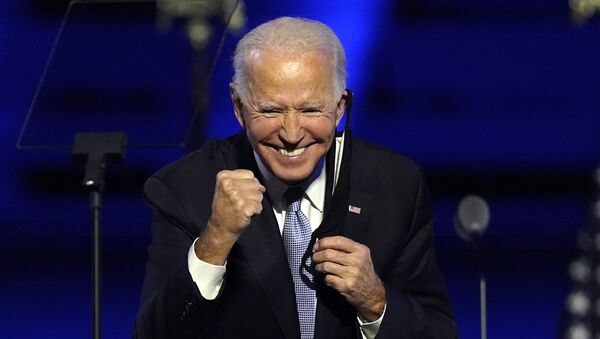 resident-elect Joe Biden gestures to supporters Saturday, Nov. 7, 2020, in Wilmington, Del - Sputnik International