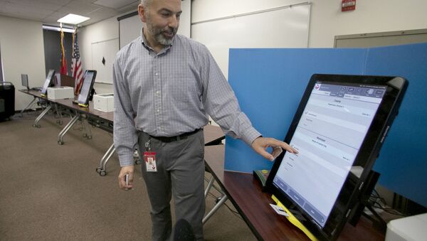  In this Sept. 16, 2019 file photo, Scott Tucker demonstrates the Dominion Voting system Georgia will use in Atlanta. - Sputnik International
