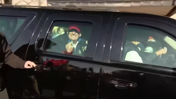 Donald Trump gives the thumbs-up to supporters as his motorcade drives through the streets of Washington, DC, 14 November 2020. - Sputnik International