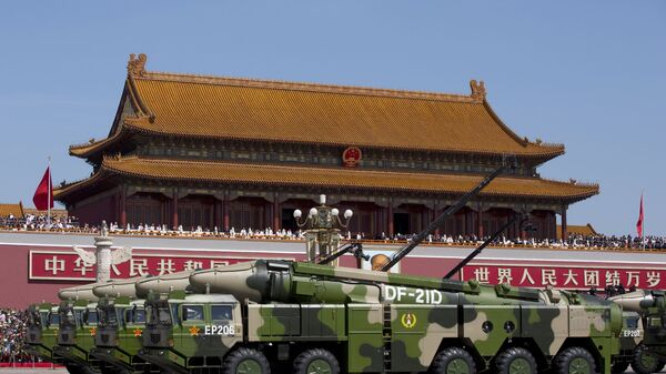 In this Sept. 3, 2015, file photo, Chinese military vehicles carrying DF-21D anti-ship ballistic missiles, potentially capable of sinking a U.S. Nimitz-class aircraft carrier in a single strike, pass by Tiananmen Gate during a military parade to commemorate the 70th anniversary of the end of World War II, in Beijing. China’s military test-fired two missiles into the South China Sea, including a “carrier killer” military analysts suggest might have been developed to attack U.S. forces, a newspaper reported Thursday, Aug. 27, 2020. - Sputnik International