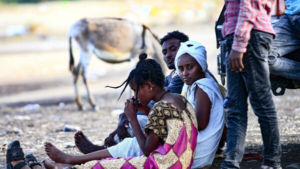 Ethiopian migrants who fled intense fighting in their homeland of Tigray, gather at the border reception centre of Hamdiyet, in the eastern Sudanese state of Kasala, on November 14, 2020.  - Sputnik International