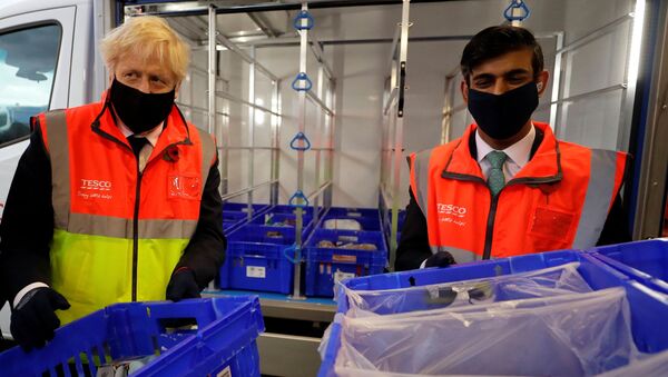 Britain's Prime Minister Boris Johnson visits a tesco.com distribution centre in London - Sputnik International
